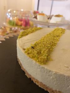 a piece of cake with green sprinkles on it at B&B L'Officina di Apollo in Mondello