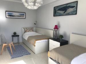 Cama o camas de una habitación en Tarifa Beachfront Large Apartment