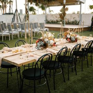 a long table with chairs and flowers on it at The Perry Hotel & Marina Key West in Key West +37 photos