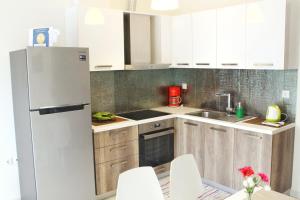 Kuchyňa alebo kuchynka v ubytovaní Polychrono Apartments