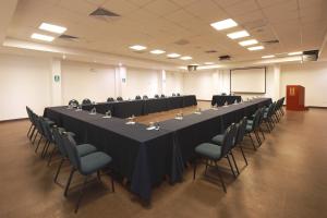 a large conference room with a long table and chairs at San Agustin Plaza in Cusco
