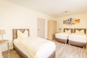 Ein Bett oder Betten in einem Zimmer der Unterkunft Boardinghaus Modern Living