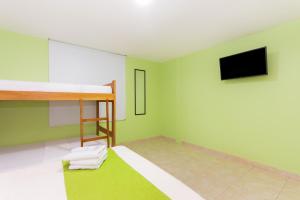 Postel nebo postele na pokoji v ubytování Hotel Avexi Suites By GEH Suites