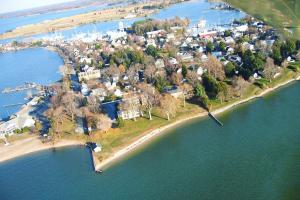 an aerial view of an island in the water at Sandaway Suites & Beach in Oxford