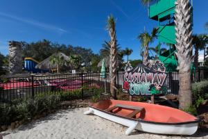 a boat on the sand in front of a playground at Holiday Inn Express & Suites S Lake Buena Vista by IHG in Kissimmee