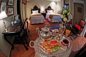 Cama ou camas em um quarto em Nino Hotel Boutique