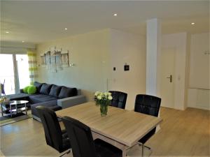 a living room with a table and a couch at Ferienwohnungen Krause in Cochem