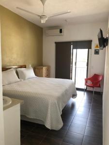 Postel nebo postele na pokoji v ubytování Hotel Del Mar