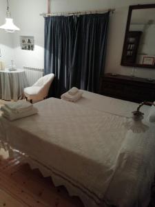 Łóżko lub łóżka w pokoju w obiekcie La Casona de Doña Clotilde