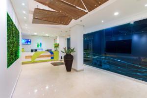 TV a/nebo společenská místnost v ubytování Hotel Aixo Suites By GEH Suites