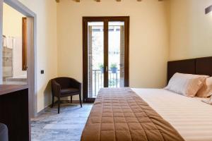 Postel nebo postele na pokoji v ubytování Agriturismo Ippolita Lucchetti