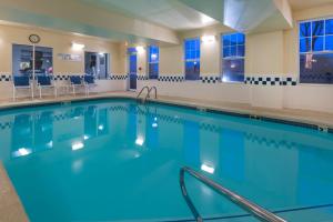 a large swimming pool with blue water at Fairfield Inn Kansas City Downtown/Union Hill in Kansas City