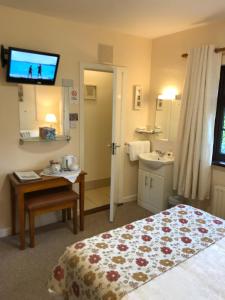 A bed or beds in a room at Athlumney Manor Guest Accommodation