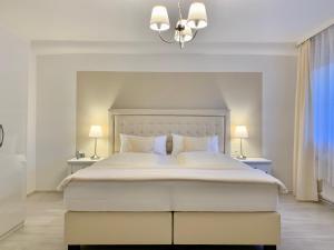 Ein Bett oder Betten in einem Zimmer der Unterkunft FeWo im Grünen mit Terrasse und Garten - gratis Therme