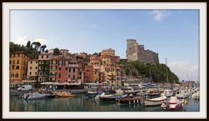 a group of boats docked in a harbor with buildings at Hotel Del Golfo in Lerici