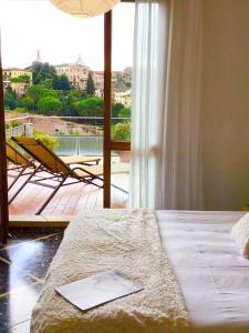 A bed or beds in a room at Attico San Francesco