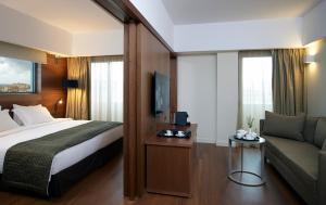 Posteľ alebo postele v izbe v ubytovaní Samaria Hotel