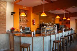 The lounge or bar area at Hotel Los Duques