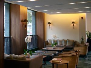 a waiting room with couches and a table at Samaria Hotel in Chania Town