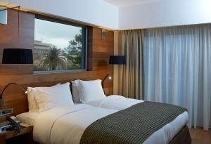 Posteľ alebo postele v izbe v ubytovaní Samaria Hotel