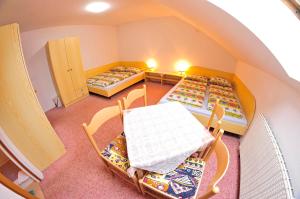 an overhead view of a room with four beds at Pension 444 - Ski Resort Herlikovice and Bubakov in Vrchlabí