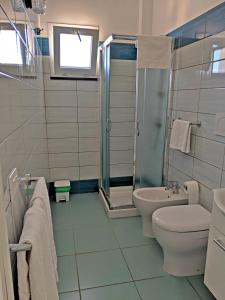 a bathroom with a shower and a toilet and a sink at B&B La Danza del Mare in Anacapri