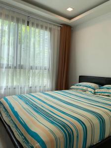 Uma cama ou camas num quarto em 2BDR in Water Resort close to WalkingStreet