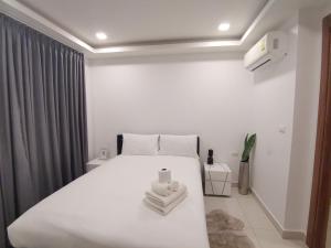 Katil atau katil-katil dalam bilik di 2BDR in Water Resort close to WalkingStreet