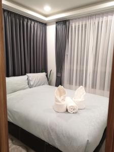 Uma cama ou camas num quarto em 2BDR in Water Resort close to WalkingStreet