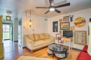 a living room with a couch and a table at River District Home with Patio and Yard Pets Welcome! in Fort Worth