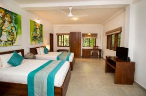 Postel nebo postele na pokoji v ubytování Amaara Forest Hotel Sigiriya + 27 fotografií