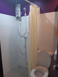 a bathroom with a toilet and a shower stall at Room@Vipa in Bangkok