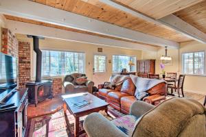 a living room with leather furniture and a fireplace at South Lake Tahoe Home with Deck and Mountain View! in South Lake Tahoe