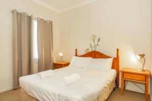 En eller flere senger på et rom på Cottage 20 - 3 Bedroom - Lake Hume Resort