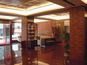 a lobby with a room with a wine cellar at The Premier Hotel in Tainan