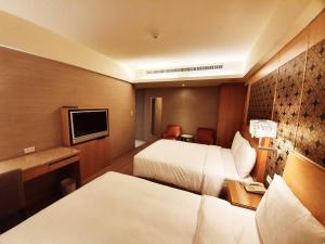 Ліжко або ліжка в номері Guide Hotel Taipei NTU