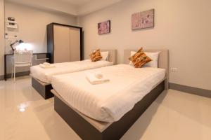 J2 Residence Chiang Rai客房内的一张或多张床位