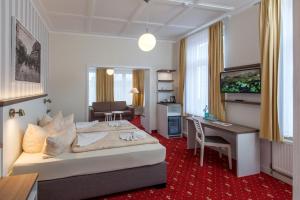 Postel nebo postele na pokoji v ubytování Hotel Weisse Düne