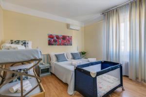 a bedroom with a bed and a bunk bed at Hotel Massimo in Marina di Cecina