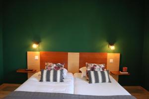 Postel nebo postele na pokoji v ubytování Auberge Au Lion d'Or