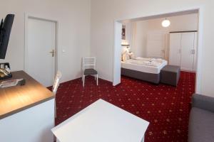 Ein Bett oder Betten in einem Zimmer der Unterkunft Hotel Weisse Düne