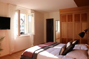 Postel nebo postele na pokoji v ubytování Auberge Au Lion d'Or