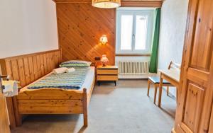 Posteľ alebo postele v izbe v ubytovaní Hotel Bernina Hospiz