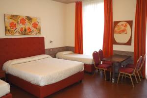 Postel nebo postele na pokoji v ubytování Hotel Ester