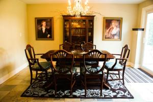 a dining room with a table and chairs at Sapience Retreat & Apothecary in Niagara-on-the-Lake