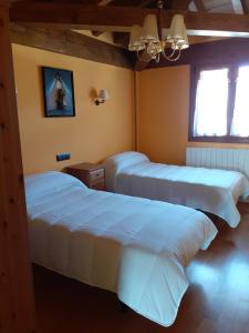Postel nebo postele na pokoji v ubytování Casa Rural Izarrak