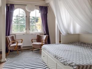 Ein Bett oder Betten in einem Zimmer der Unterkunft Villa Erika
