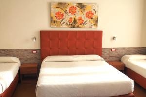 Postel nebo postele na pokoji v ubytování Hotel Ester