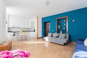 a living room with a couch and a table at Family Lake Apartment by Rent All Como in Mezzegra