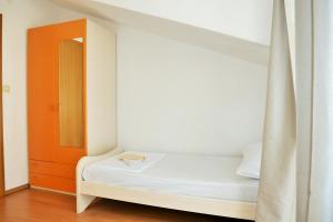 Posteľ alebo postele v izbe v ubytovaní Apartments Sandy Beach